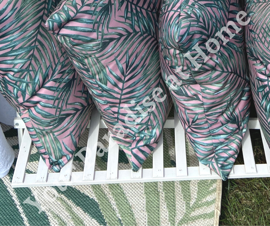 Palm leaves on blush pink background outdoor cushion for your garden. Weatherproof fabric is water resistant and UV resistant. Cushion covers are zipped and washable.