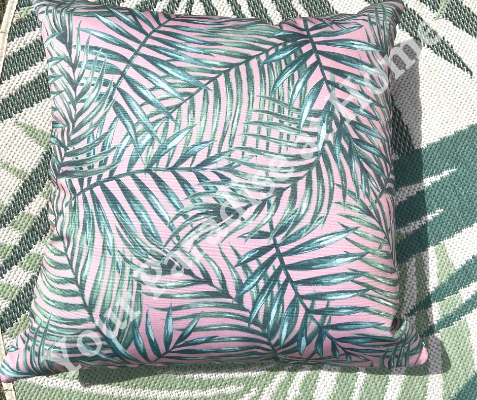 Palm leaves on blush pink background outdoor cushion for your garden. Weatherproof fabric is water resistant and UV resistant. Cushion covers are zipped and washable.
