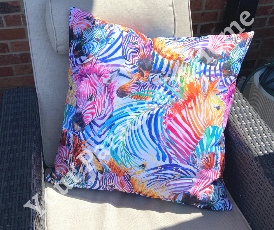 Rainbow zebras outdoor cushion for your garden. Weatherproof fabric is water resistant and UV resistant. Cushion covers are zipped and washable