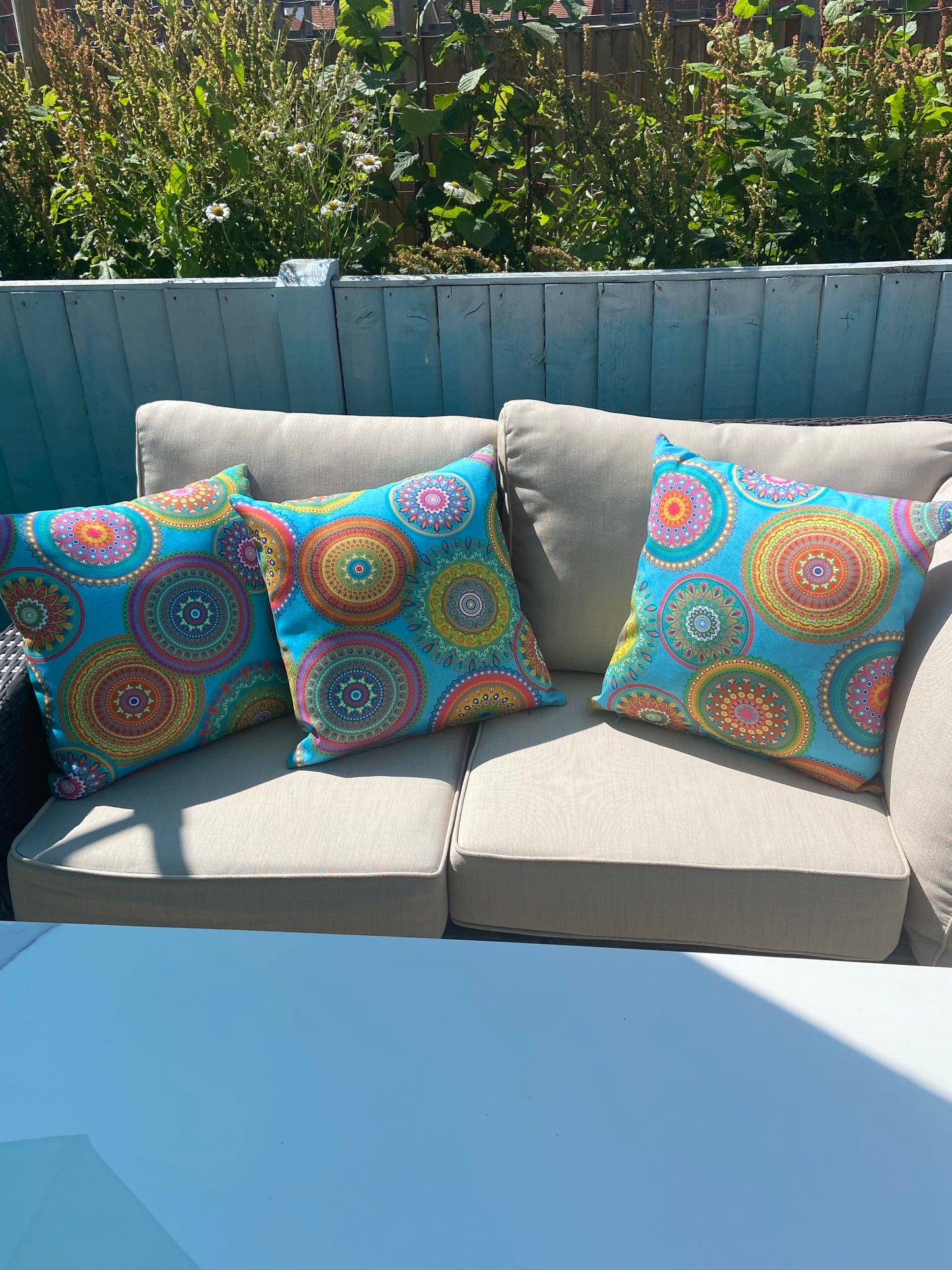 Turquoise Mandalas outdoor cushion for your garden to add vibrant colours. Weatherproof fabric is water resistant and UV resistant. Cushion covers are zipped and washable.