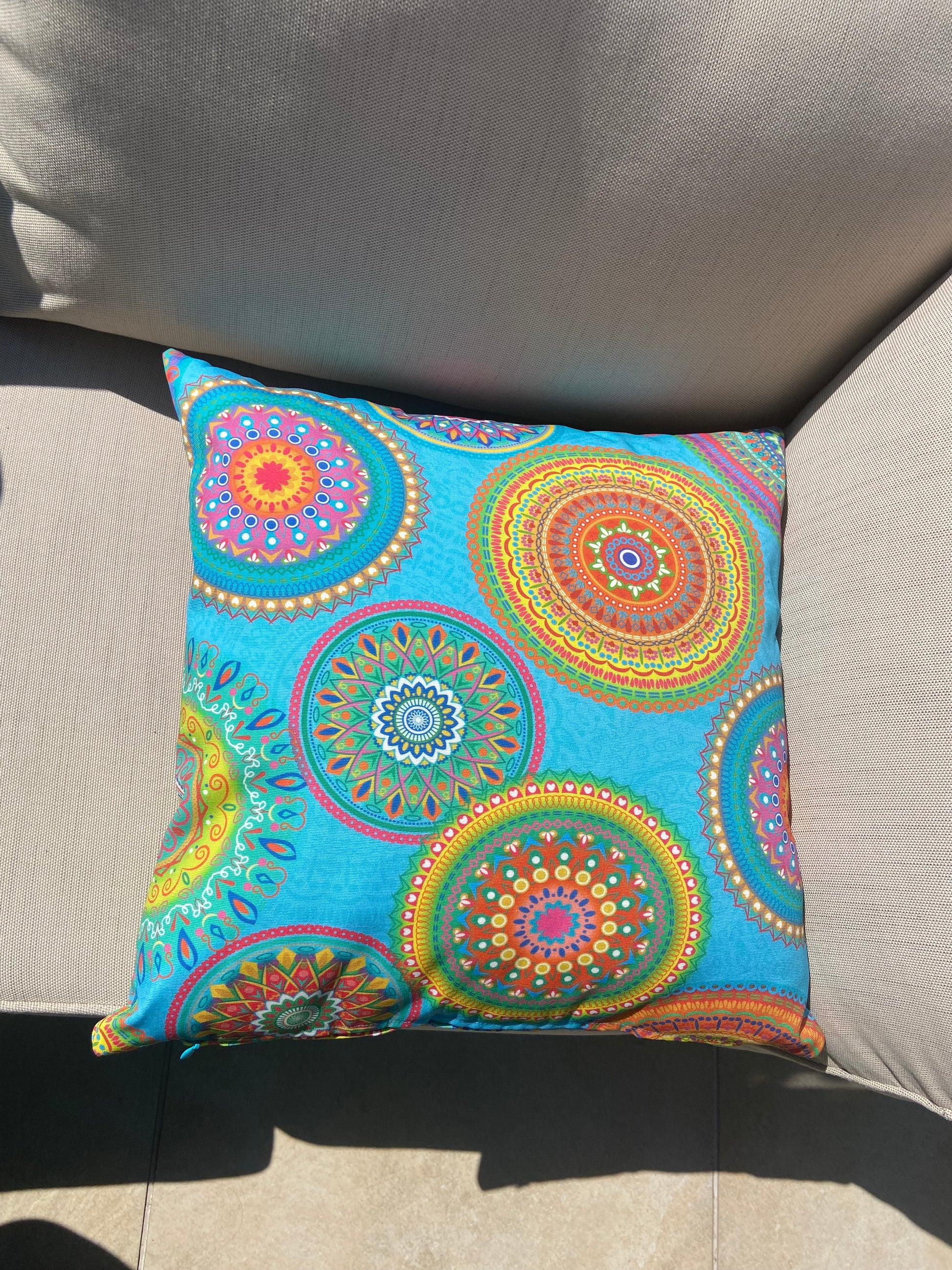 Turquoise Mandalas outdoor cushion for your garden to add vibrant colours. Weatherproof fabric is water resistant and UV resistant. Cushion covers are zipped and washable.
