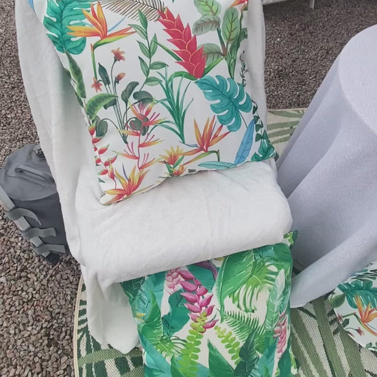 White Heliconia table runner with exotic flower design.  Weatherproof fabric  perfect for indoor or outdoor entertaining